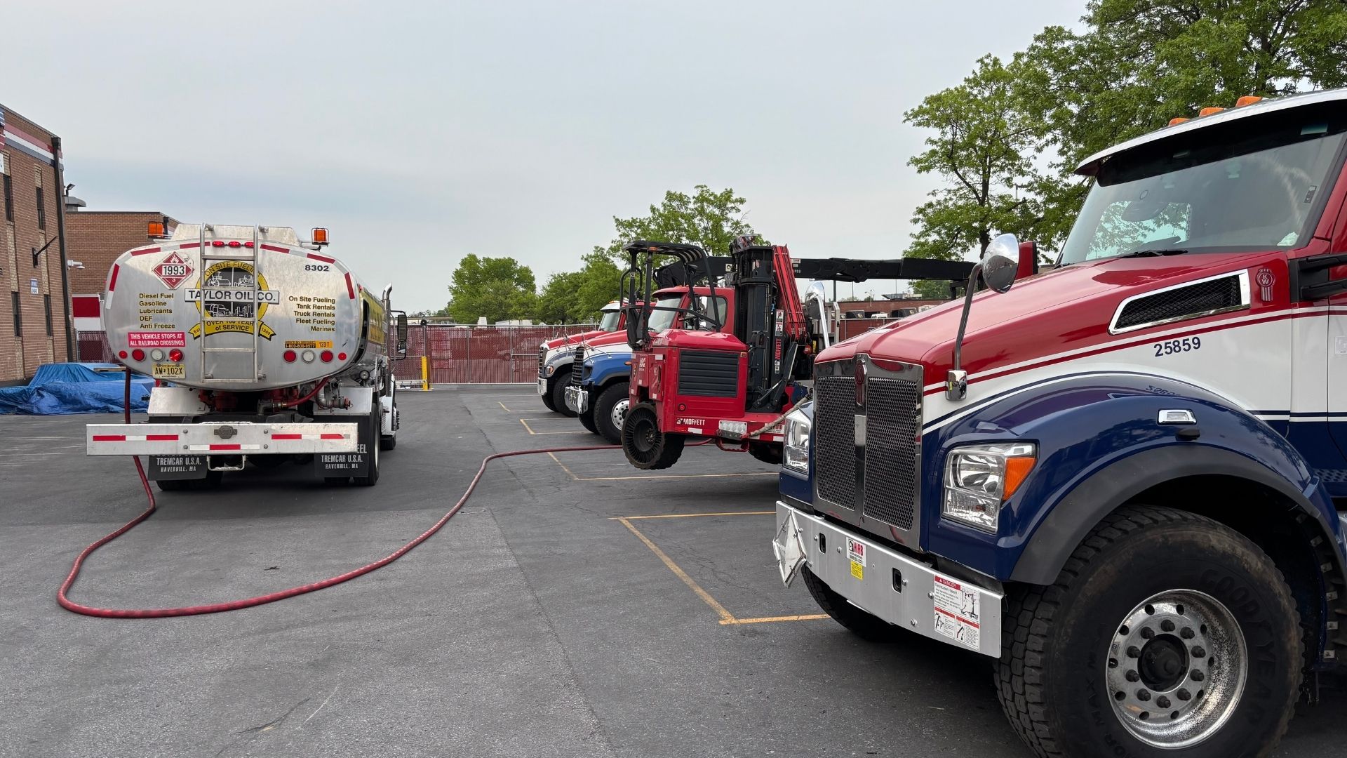 a Taylor Oil Co truck performing fleet fueling at a customer's yard
