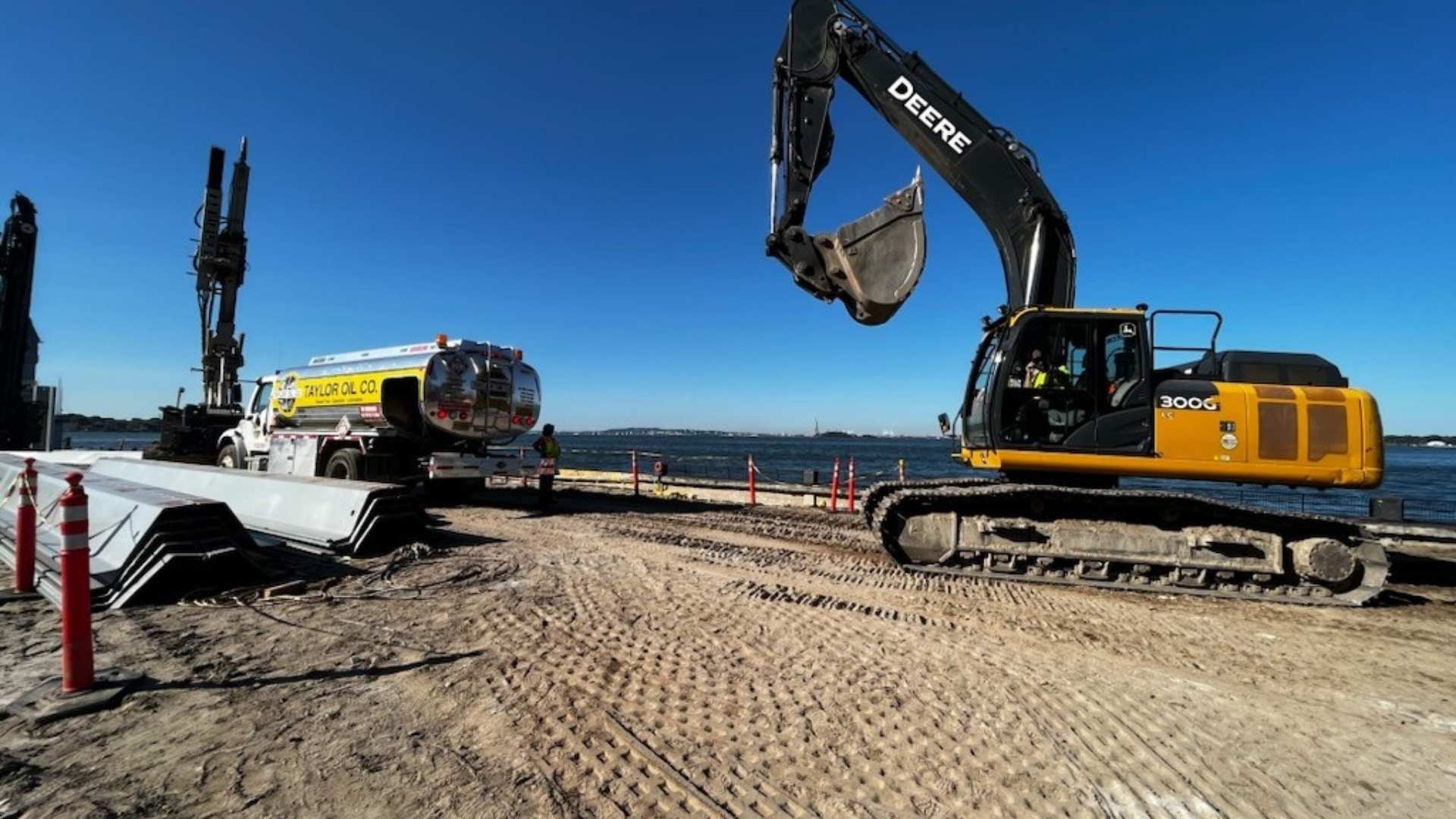 construction-site-fuel-delivery-taylor-oil-co Taylor Oil Co. truck providing mobile wet hose fueling for a construction excavator in Philadelphia, PA.
