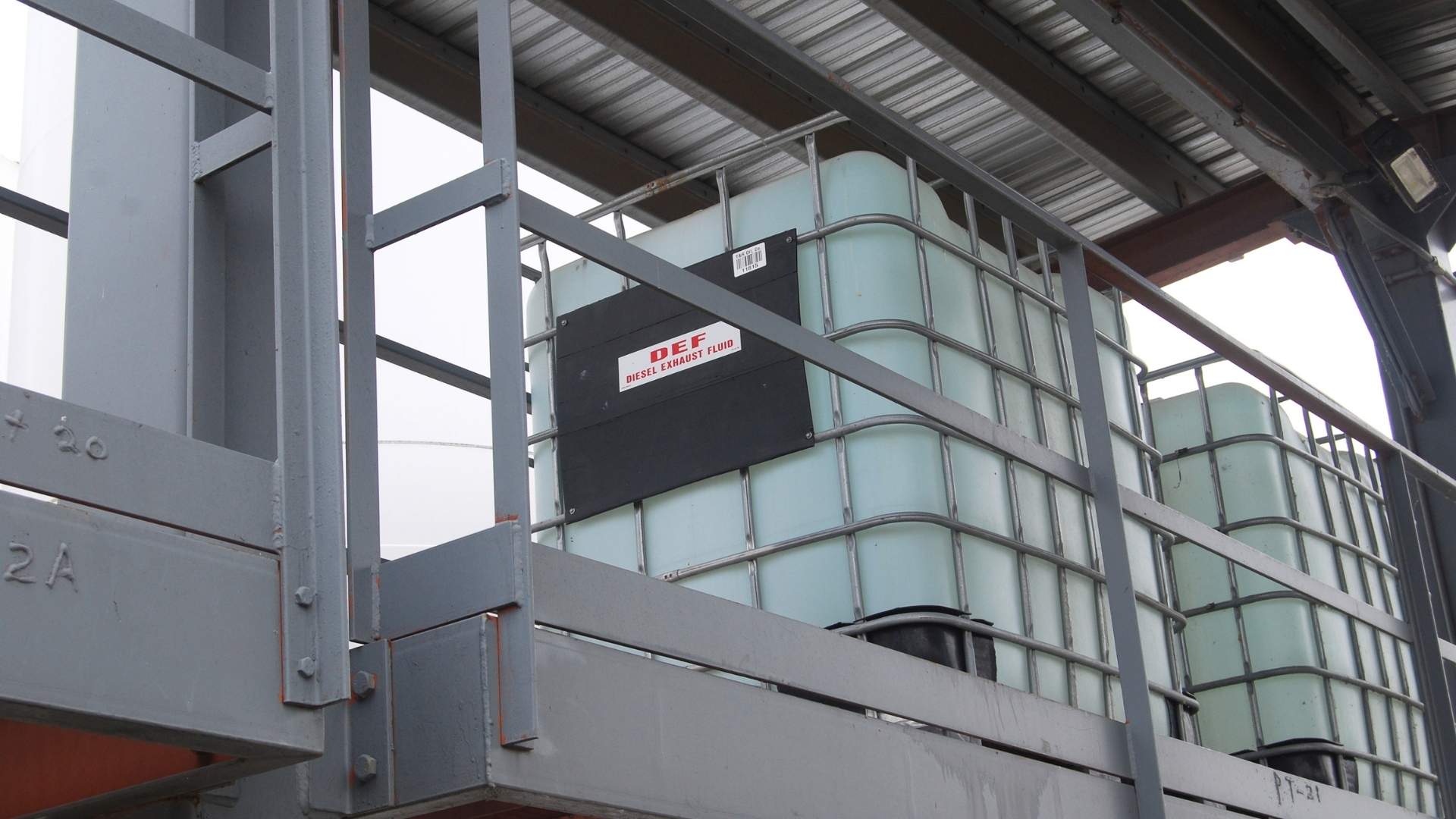 DEF tank at a Taylor Oil Co. yard — diesel exhaust fluid storage for on-site fleet fueling